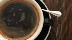 an overhead view of a cup of coffee on a saucer