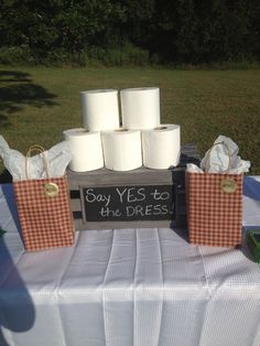 several rolls of toilet paper sitting on top of a table