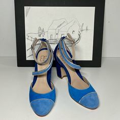 With Elegant Color-Blocking And Silver Trim Details, This Nola D'orsay Heel Is A Head-Turner. Features A D'orsay Style Design And Adjustable Foot And Ankle Strap. The Nola Shoe Has It All Including A Roomy Round Toe Box And Integrated Comfort Technology. Pairs Perfectly With Jeans, White Pants, Or A Flowy Skirt, You'll Love The Killer Color-Blocking And Stable Chunky Heel. The Nola D'orsay Pump Is Consciously Crafted, Pieces Made To Be Good For You And Good For The Planet. Integrated All Day Com Blue Block Heels With Contrasting Heel Counter, Blue Ankle Strap Heels With Contrasting Heel, Blue Low Heel Shoes With Heel Strap, Blue Low Heel With Heel Strap, Blue Ankle Strap Heels For Evening, Chic Blue Court Shoes For Evening, Chic Blue Heels For Gala, Chic Blue Evening Court Shoes, Blue Padded Heel Court Shoes