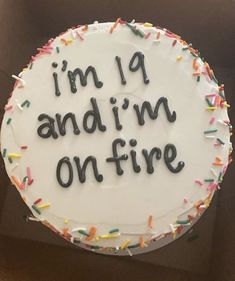 a birthday cake that says i'm 9 andim on fire with sprinkles