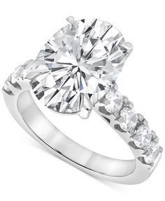 a diamond ring with three stones on the side