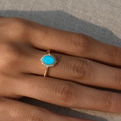 "Natural Blue Turquoise Engagement Ring in 14k Yellow Gold/Oval Turquoise with Diamond Halo/Unique Engagement Ring/Gift For Her/Bridal Ring ★ ★ ★ ★ CUSTOM/DUTY-FREE SHIPPING WORLDWIDE, BUYERS DON'T HAVE TO PAY ANY CUSTOM FEES WHILE IMPORTING ★ ★ ★ ★ Details Made to order Material: 14k/18k gold Color Options: Yellow Gold, White Gold, Rose Gold ★ Center Stone Turquoise, Oval Cab Size: 5X7 mm Approx Weight (Ct): 0.96 ★ Accent Stones Diamond Round Size: 1.1 mm * 16 No.s , 1.5 mm * 4 Nos. Approx Weig Engagement Rings Turquoise Diamond, Gold Band Engagement Rings, Turquoise Engagement Ring, Turquoise Diamond Rings, Turquoise Ring Engagement, Pretty Engagement Rings, Oval Jewelry, Turquoise Gold Ring, Unique Engagement Ring