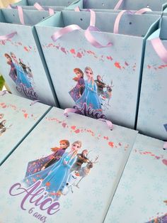 several frozen princess bags are lined up on the table