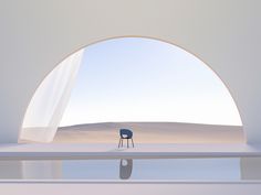 a chair sitting on top of a white floor next to an open window in the middle of a desert