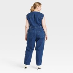 Add this Tailored Denim Jumpsuit from Universal Thread™ to your everyday wardrobe for putting together a variety of chic outfits. Made of recycled cotton, this denim jumpsuit is fashioned in a crewneck style with a zipper for easy on and off. This sleeveless jumpsuit boasts two front pockets and two back pockets to keep your essentials close at hand and also features belt hoops for versatile wear. Universal Thread™: Found exclusively at Target. Fitted Cotton Utility Denim Jumpsuit, Fitted Cotton Denim Utility Jumpsuit, Relaxed Fit Dark Wash Denim Jumpsuit, Medium Wash Cotton Jumpsuit For Work, Workwear Medium Wash Cotton Jumpsuit, Medium Wash Cotton Jumpsuits And Rompers For Work, Cotton Jumpsuit For Work In Medium Wash, Medium Wash Relaxed Fit Cotton Denim Jumpsuit, Dark Wash Cotton Jumpsuit For Work