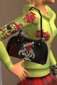 a woman in a green sweater holding a black purse with skulls and roses on it