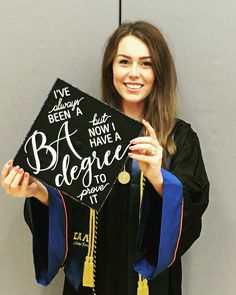 a woman holding up a graduation cap that says, i've been a graduate