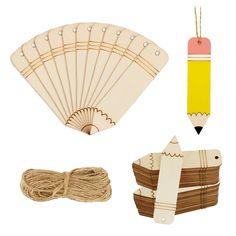 an assortment of craft items including a wooden fan, string and paper clips on a white background