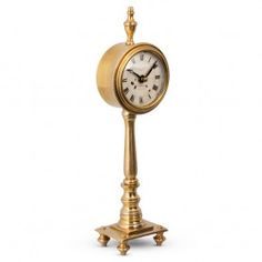 an old fashioned clock on a stand against a white background