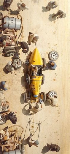 an aerial view of a yellow vehicle with wheels and tires