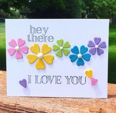 a card with flowers on it that says, they there i love you and hearts