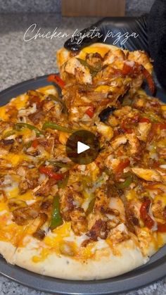 a pizza sitting on top of a pan covered in toppings