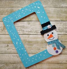 a wooden frame with a snowman on it