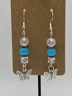 Handmade Earrings - Butterfly Series Each piece is meticulously handcrafted using craft wire, hypoallergenic earring hooks, and premium beads including crystal, glass, wood, ceramic, acrylic, resin, stone, and silicone beads. Care Instructions: Avoid moisture. Remove prior to bathing, showering, swimming, or exercising. Avoid allowing the item to fold when storing.  Shipping Information: Your items will be shipped within 1-2 business days once payment is received. Shipping within the US is via first class mail or you may choose to upgrade to Priority Mail for a small fee. First class shipping is free for orders over $35. Each item is carefully wrapped and packaged for safety during transit. Returns & Exchanges: As this is a wearable item, I do not accept returns or exchanges on this item. Resin Stone, Earrings Butterfly, Wood Ceramic, Earring Ideas, Creating Jewelry, Hypoallergenic Earrings, Earring Hooks, Silicone Beads, Handmade Earrings