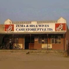 an old building with a sign that says zuma and his 6 wives cash store pty ltd