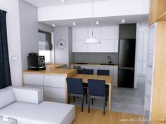 an open concept kitchen and living room with white walls, wood flooring and blue curtains