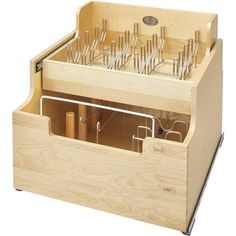 a wooden box with many different types of scissors in it's drawer, and the lid is open