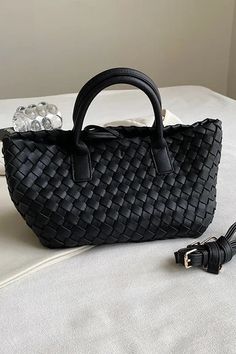 Medium sized vegan leather woven tote. Removable leather shoulder strap and top handles. Classic and timeless style. Black Shoulder Bag With Intrecciato Weave And Double Handle, Black Double Handle Shoulder Bag With Intrecciato Weave, Black Intrecciato Weave Shoulder Bag With Double Handle, Black Rectangular Satchel With Intrecciato Weave, Black Intrecciato Weave Top Handle Bucket Bag, Rectangular Woven Leather Satchel For Errands, Chic Bucket Bag With Braided Handles As Shoulder Bag, Chic Shoulder Bucket Bag With Braided Handles, Shoulder Bag With Double Braided Handles For Errands