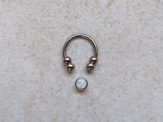 "Silver Septum Clicker or Daith Earring Ring with White Opal 📯 SPECIAL OFFER: If you buy this White Opal septum ring, together with either Blue or Purple, you will get 3rd one as a gift! 🎁 Blue: https://www.etsy.com/listing/793235153/silver-septum-clicker-daith-earring-ring Purple: https://www.etsy.com/listing/794876351/silver-septum-clicker-ring-daith-earring HOW YOU CAN WEAR IT? ❖ daith captive bead ring ❖ septum captive bead ring ❖ septum horseshoe ❖ septum retainer DIMENSIONS ❖ 16 gauge (1 Round Septum Ring Gift, Gift Metal Septum Ring Internally Threaded, Nickel Free Metal Septum Ring As Gift, Nickel-free Metal Septum Ring As Gift, Nickel Free Metal Septum Ring Gift, Unique Nickel-free Septum Ring As Gift, Nickel Free Round Septum Ring As Gift, Nickel-free Round Septum Ring As Gift, Nickel-free Spiritual Septum Ring As Gift