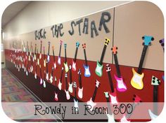 the hallway in room 350 is decorated with guitars and words that read take the star