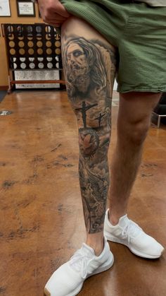 a man with a tattoo on his leg