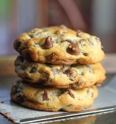 three chocolate chip cookies stacked on top of each other