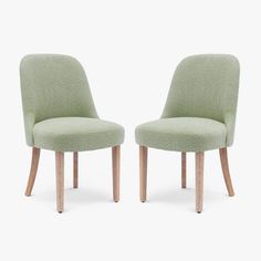 two green chairs sitting side by side