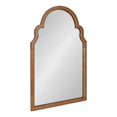 a wooden mirror with an arch shaped frame and wood trim around the edges, on a white background