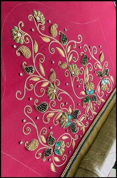 pink and gold embroidered fabric with floral design on the front, along with an intricately designed clutch bag