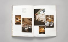 an open book with pictures of food and drinks on the pages, in front of a gray background