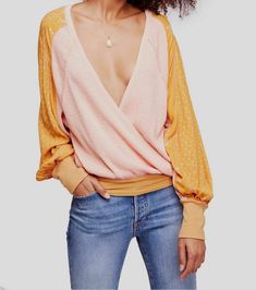 $195 Free People Womens PInk Yellow V-Neck Long-Sleeve V-Neck Shirt Blouse Top S Description Product Details Fashioned with a deep V-neck, Free People's lightweight thermal top features contrasting prints for the tie at waist and the long draping sleeves. Relaxed fit; hits at waist Deep V-neckline Wrap style; tie at side; mixed prints Long flared sleeves with cuff Polyester/rayon Machine washable Imported About Us We sell only 100% authentic clothing from new with tags to gently used. We have a Long Sleeve Wrap Top, Flirty Tops, Tie Waist Top, Shirt Blouses Tops, Thermal Top, Feminine Dress, Junior Outfits, Wrap Blouse, Printed Sleeves