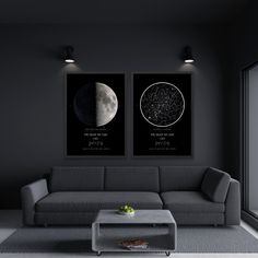 two black and white posters on the wall above a couch in a room with dark walls