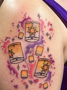 a woman's stomach with tattoos on it and three glasses in the middle of her stomach