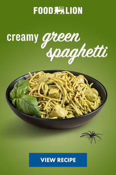 a plate of spaghetti with pesto on it and the words, creamy green spaghetti view recipe