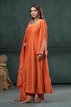 Orange anarkali with an embroidered neckline and sleeves. Paired with a line embroidered pant and scallop dupatta with tassels. - Aza Fashions Anarkali Floor-length Dress With Embroidered Border, Semi-stitched Floor-length Kurta With Resham Embroidery, Floor-length Semi-stitched Kurta With Resham Embroidery, Floor-length Anarkali Dress With Embroidered Border, Transitional Anarkali Dresses With Embroidered Border, Floor-length Semi-stitched Resham Embroidery Kurta, Anarkali Dress With Embroidered Border And Long Sleeves, Anarkali Dress With Embroidered Border For Eid, Long Sleeve Anarkali Dress With Embroidered Border