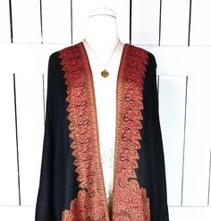 "Handmade black and orange border paisley pashmina kimono cover up jacket with custom regular and maxi lengths and optional fringe detail Measurements...taken flat - width across seam to seam: 46\" - regular length with fringe: 38\" - regular length without fringe: 34\" - Maxi length is as selected with or without fringe Features... - lovely soft woven medium weigh pashmina fabric - bohemian oversized flowing design - cardigan style with an open front and generous arm holes - universal design al Elegant Embroidered Shawl For Fall, Elegant Embroidered Fall Shawl, Traditional Black Shawl Outerwear, Traditional Paisley Print Shawl For Fall, Bohemian Black Pashmina Shawl For Festive Occasions, Fall Shawl With Tassels, Fall Tassel Shawl, Traditional Shawl Kimono For Fall, Bohemian Shawl For Fall Festive Occasion