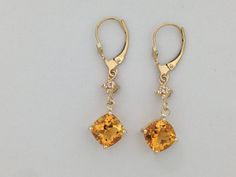 "SOLID 14KT YELLOW GOLD DANGLE EARRINGS NATURAL CITRINE IS  8x8 mm EACH (3.50 TCW) NATURAL DIAMOND IS 0.04 TCW EARRING LENGTH IS 1.3/8\" INCHES WITH GIFT BOX" Yellow 14k Gold Fine Jewelry Earrings, Formal Yellow 14k Gold Earrings, Classic Yellow Earrings For Anniversary, Yellow Citrine Earrings With Prong Setting, Yellow Drop Earrings With Prong Setting, Classic Yellow Citrine Earrings, Yellow Prong Setting Drop Earrings, Yellow Gold Citrine Dangle Earrings, Yellow 14k Gold Fine Earrings