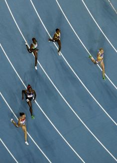 the women are running on the track together