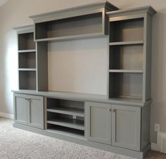 the entertainment center is on sale for $ 549 00 and has been painted gray