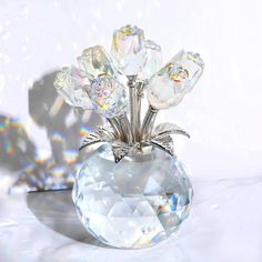 a crystal vase sitting on top of a white table