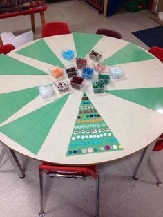 an image of a christmas tree made out of stickers on a table with chairs