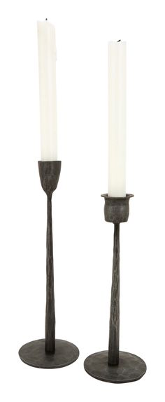 two candles sitting on top of each other