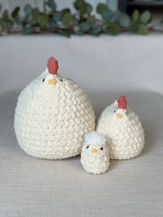 two crocheted chickens sitting next to each other