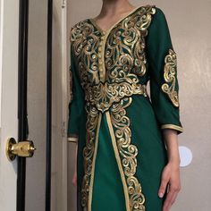 Gold And Green Mid Sleeved Middles Eastern Gown. Only Worn Once And Is In Perfect Condition. The Material Is Satin And It Comes With A Matching Belt That Ties Around The Waist. Also Floor Length. Green Festive Dresses For Ceremonies, Green Festive Dress For Ceremony, Festive Green Dress For Ceremonies, Festive Fitted Kaftan For Wedding, Fitted Festive Kaftan For Wedding, Elegant Fitted Green Kaftan, Green Festive Evening Dress For Wedding, Festive Green Evening Dress For Wedding, Middle Eastern Wedding