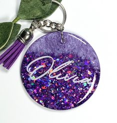 a purple keychain with the word diy on it and a tassel