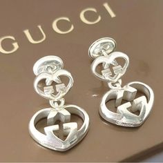 See Pictures For More Details. Comes With Gucci Box Gucci Silver Jewelry Gift, Gucci Luxury Sterling Silver Earrings, Gucci Heart-shaped Jewelry For Gifts, Gucci Silver Jewelry With Silver-tone Logo Plaque, Elegant Gucci Jewelry With Silver-tone Logo, Gucci Box, Gucci Jewelry, See Pictures, See Picture