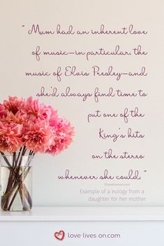 a vase filled with pink flowers sitting on top of a white shelf next to a wall