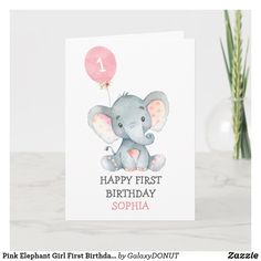 a birthday card with an elephant holding a balloon