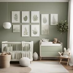 a baby's room with green walls and pictures on the wall