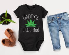 Daddy's Little Bud Baby Outfit, Mommy's Little Bud Baby Outfit, Baby Shower Gift, Newborn Bodysuit, Daddy Kids Shirt, Daddy Toddler Gift HOW TO PLACE YOUR ORDER * Choose your t-shirt color * Choose your size * Choose your design&text color * PLEASE make sure all your order's steps PRODUCT DESCRIPTION  t-shirt feels soft and light, with just the right amount of stretch. It's comfortable and the unisex cut is flattering for both men and women. * Solid colors are 100% combed and ring-spun cotton * Ash color is 99% combed and ring-spun cotton, 1% polyester * Heather colors are 52% combed and ring-spun cotton, 48% polyester * Athletic and Black Heather are 90% combed and ring-spun cotton, 10% polyester * Heather Prism colors are 99% combed and ring-spun cotton, 1% polyester * Fabric weight: 4.2 Baby Boy Must Haves, Baby Onsies Ideas Funny, Newborn Baby Stuff, Fun Baby Announcement, Country Baby Shower, Gothic Baby, Outfit Baby Shower, Goth Baby